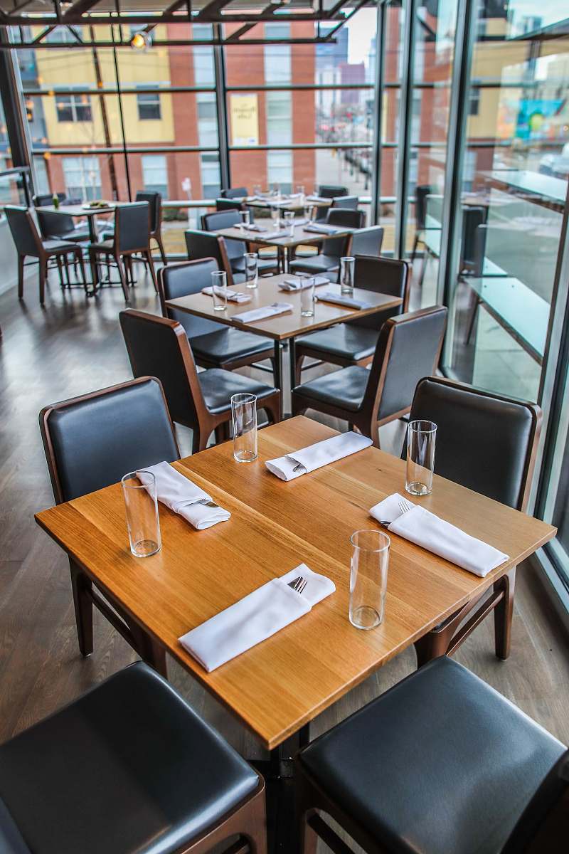 conference room square brown wooden table and chairs indoors